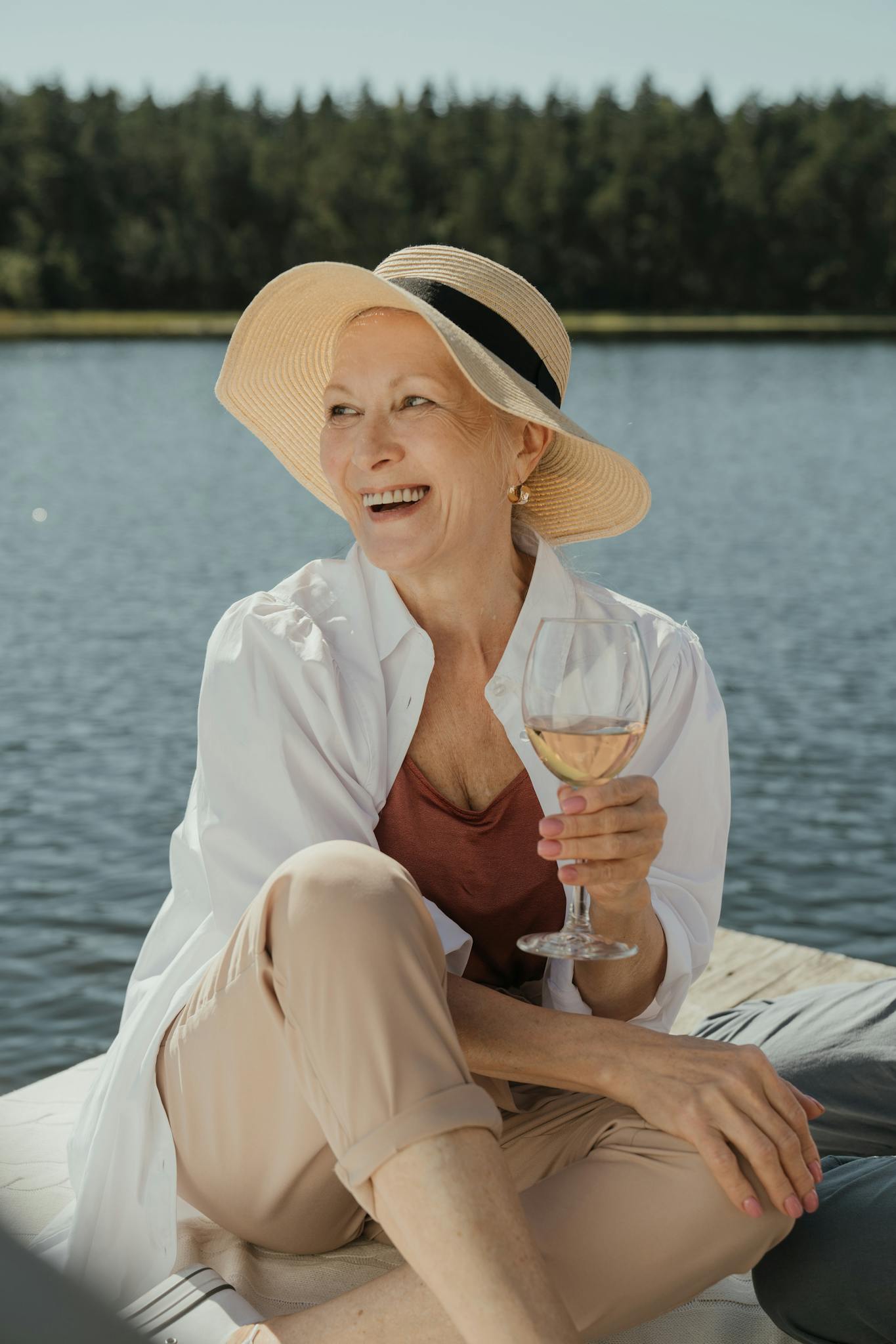 Woman in White Dress Shirt Holding Clear Drinking Glass